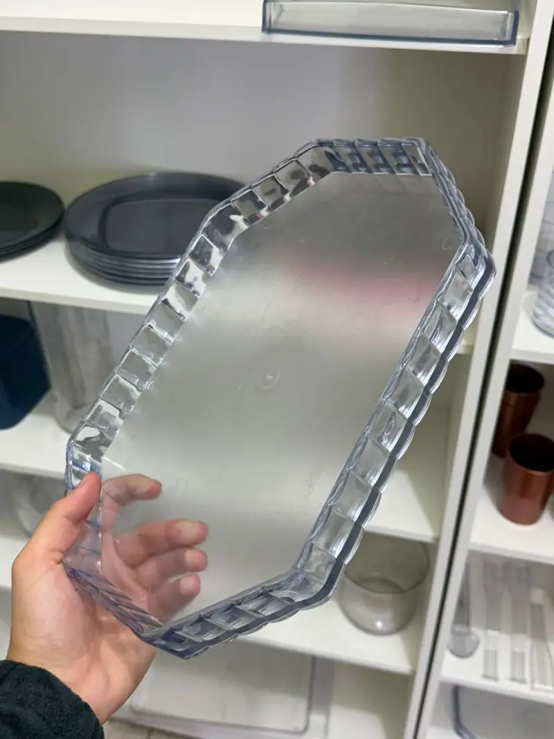 Plastic part produced by the mold for a decorated tray