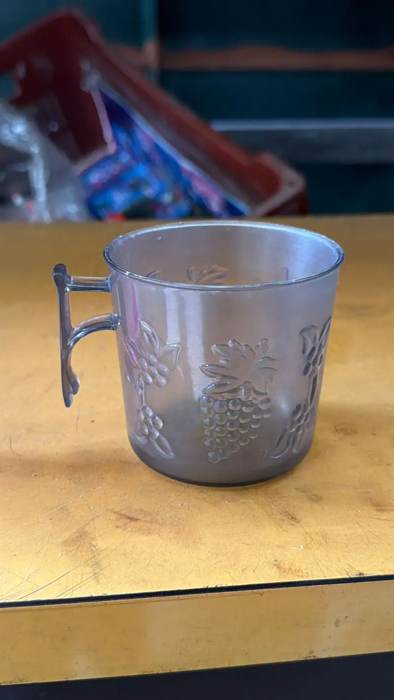 Plastic part produced by the mold for a mug with grape relief