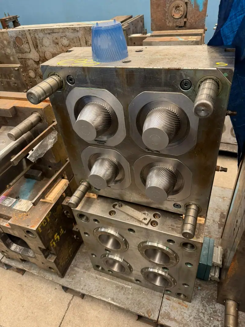 Plastic injection mold for a decorated cup with 4 cavities
