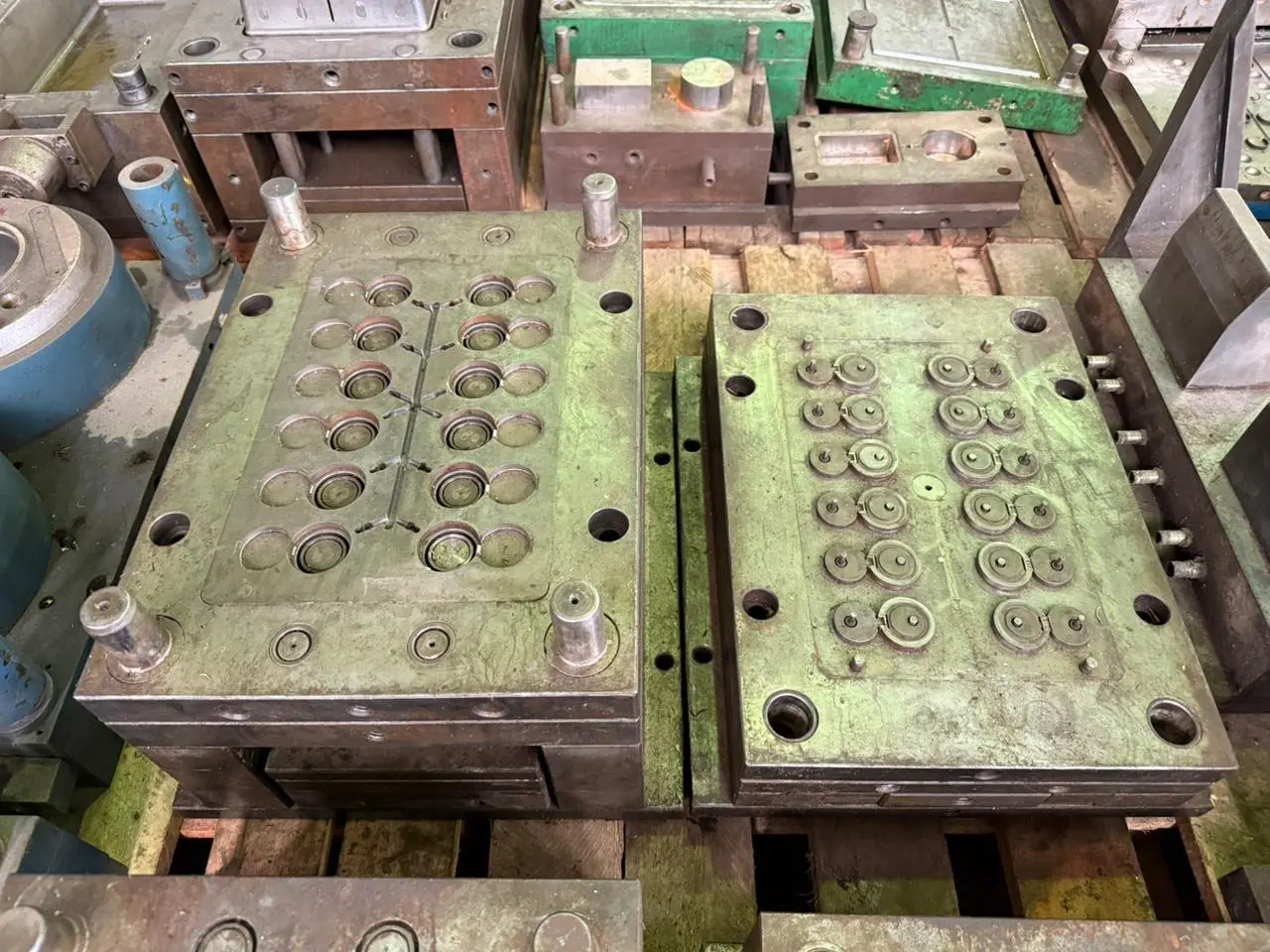 Plastic injection mold for a flip top cap