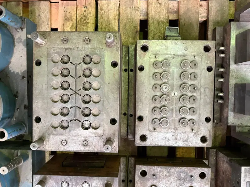 Injection mold for a flip top cap — view 3
