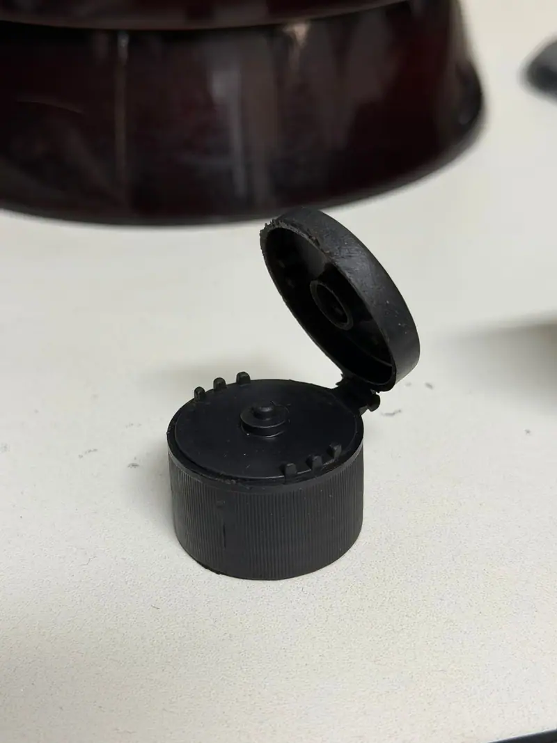 Plastic part produced by the mold for a flip top cap
